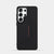 A black protective phone case with a textured carbon-fiber pattern and a vertical red 'MINIMALIST DESIGN' logo, shown on a light gray background.