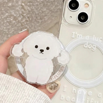 Phone case with a cute white dog design held by a hand